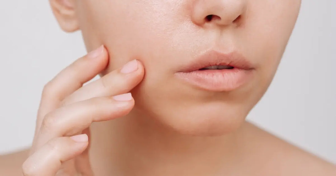 Woman checking her clear skin results after an Oily skin brightening routine